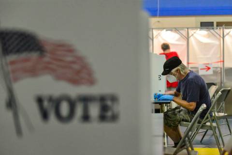 FILE - Bill Hurley, of Chesterfield, N.H., fills out his ballot at the Chesterfield, N.H., poll ...