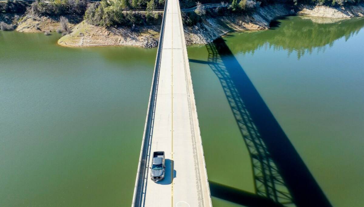 A car crosses Enterprise Bridge over Lake Oroville on Sunday, March 26, 2023, in Butte County, ...