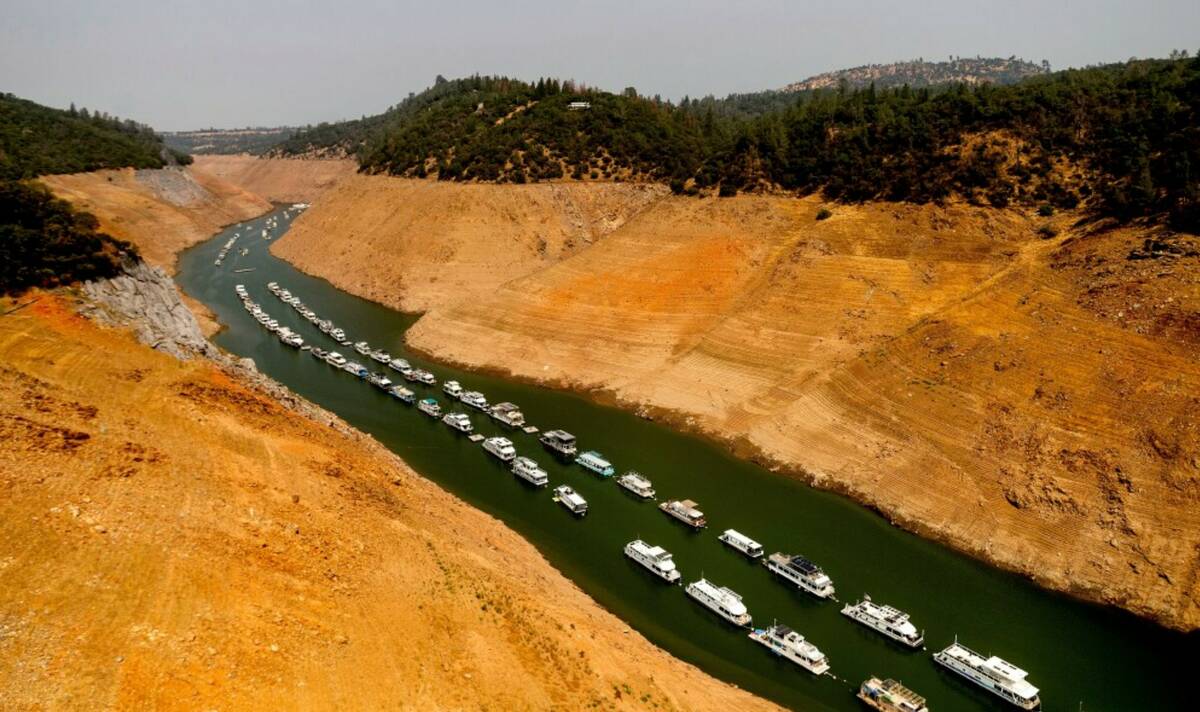 Houseboats rest in a channel at Lake Oroville State Recreation Area in Butte County, Calif., on ...