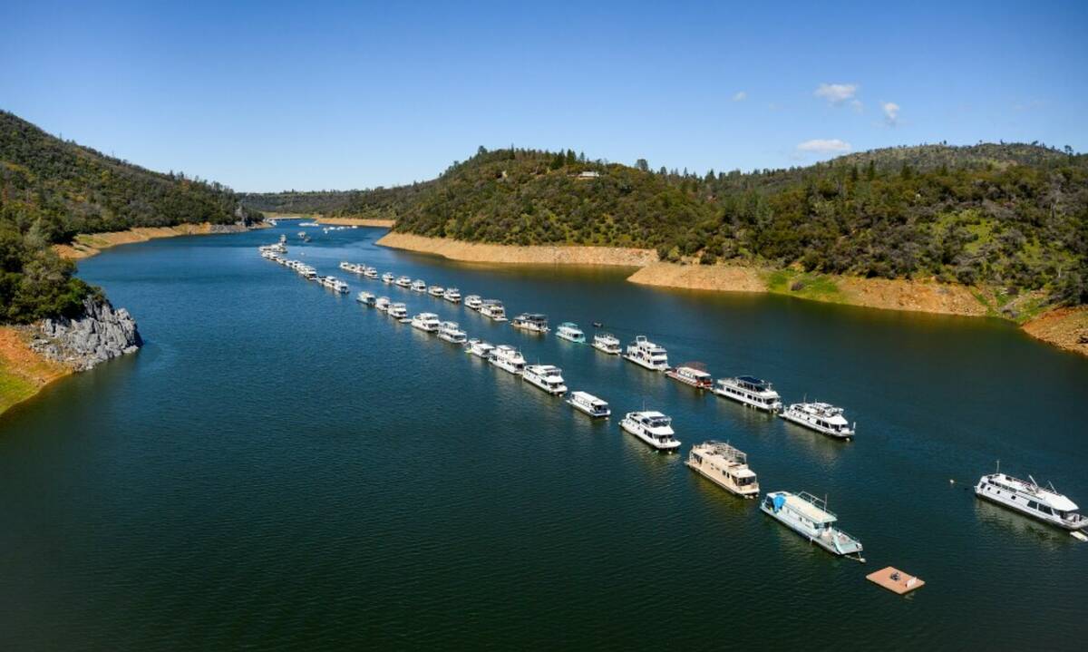 Houseboats float at Lake Oroville State Recreation Area on Sunday, March 26, 2023, in Butte Cou ...