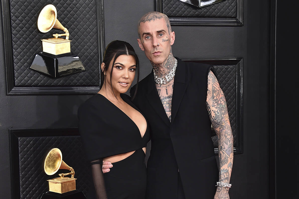 Kourtney Kardashian, left, and Travis Barker appear at the 64th Annual Grammy Awards in Las Veg ...