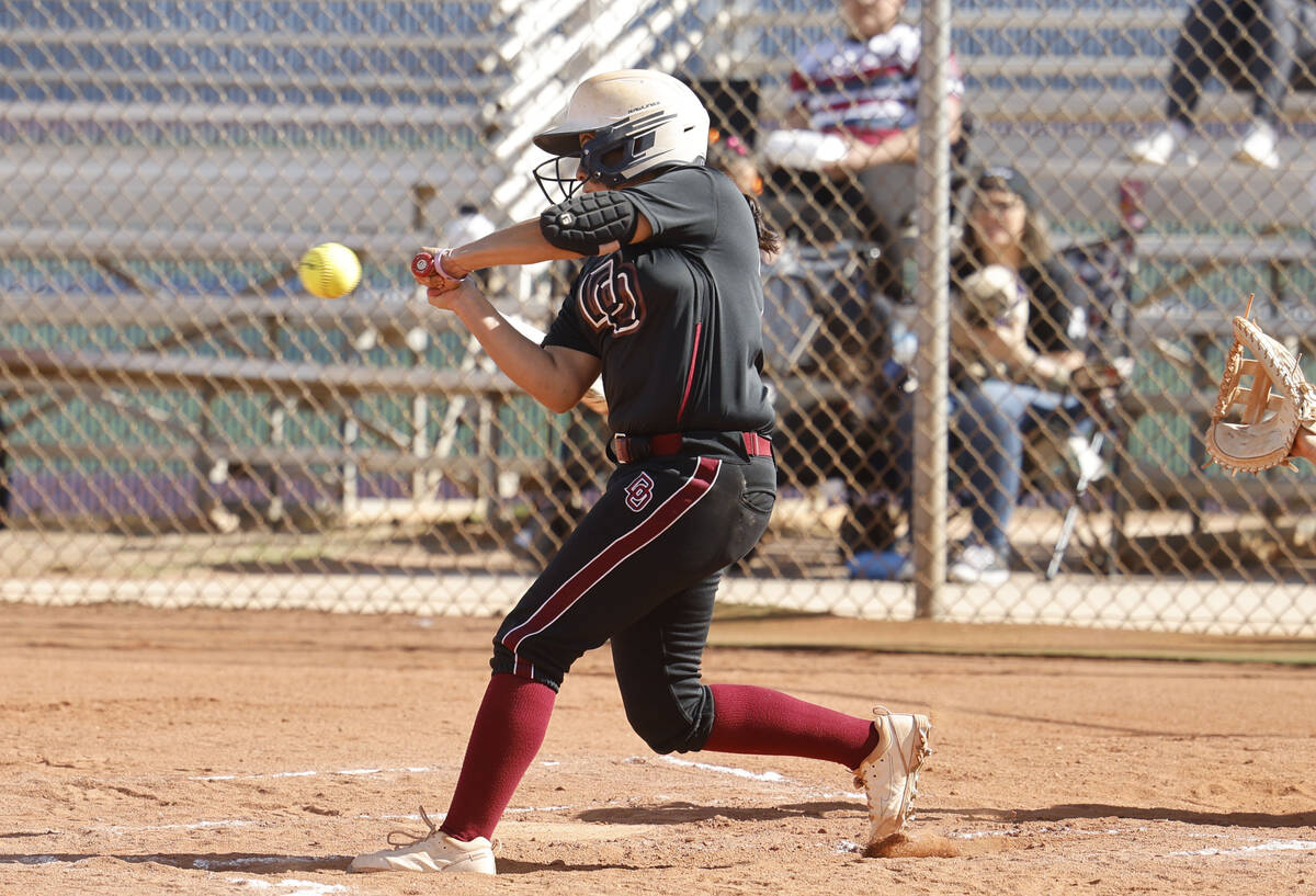 Desert Oasis' Aisah Findlay (26) keeps her eye on the ball during the third inning of a softbal ...