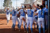 Centennial's Keana Bell (13), far left, celebrates with her teammates after hitting a two-run h ...