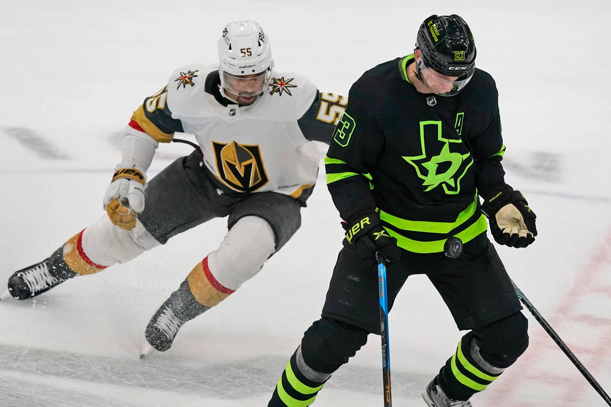 Dallas Stars defenseman Esa Lindell (23) tries to control the puck against Vegas Golden Knights ...