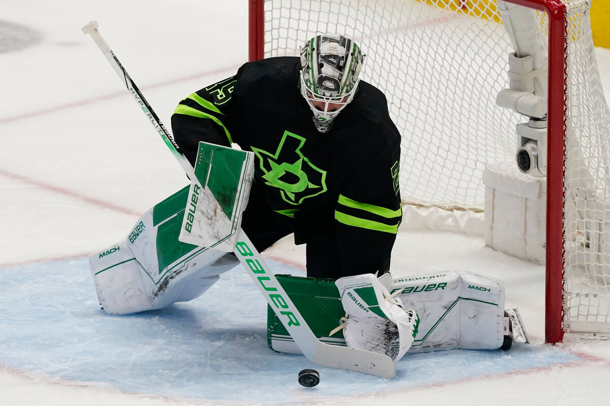 Dallas Stars goaltender Jake Oettinger (29) defends the goal during the first period of an NHL ...