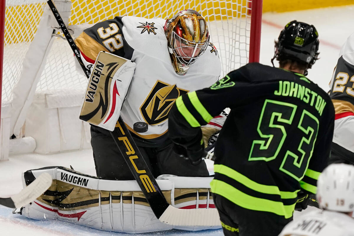 Vegas Golden Knights goaltender Jonathan Quick (32) blocks a shot by Dallas Stars center Wyatt ...