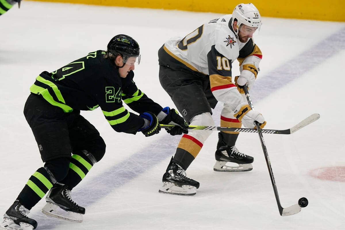 Vegas Golden Knights center Nicolas Roy (10) skates with the puck as Dallas Stars center Roope ...