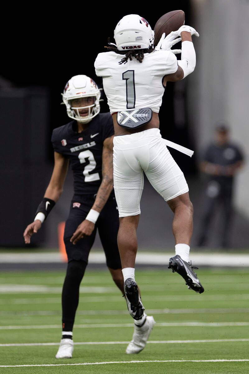 Defensive back Jalen Frazier (1) knocks down a pass by quarterback Doug Brumfield (2) during th ...