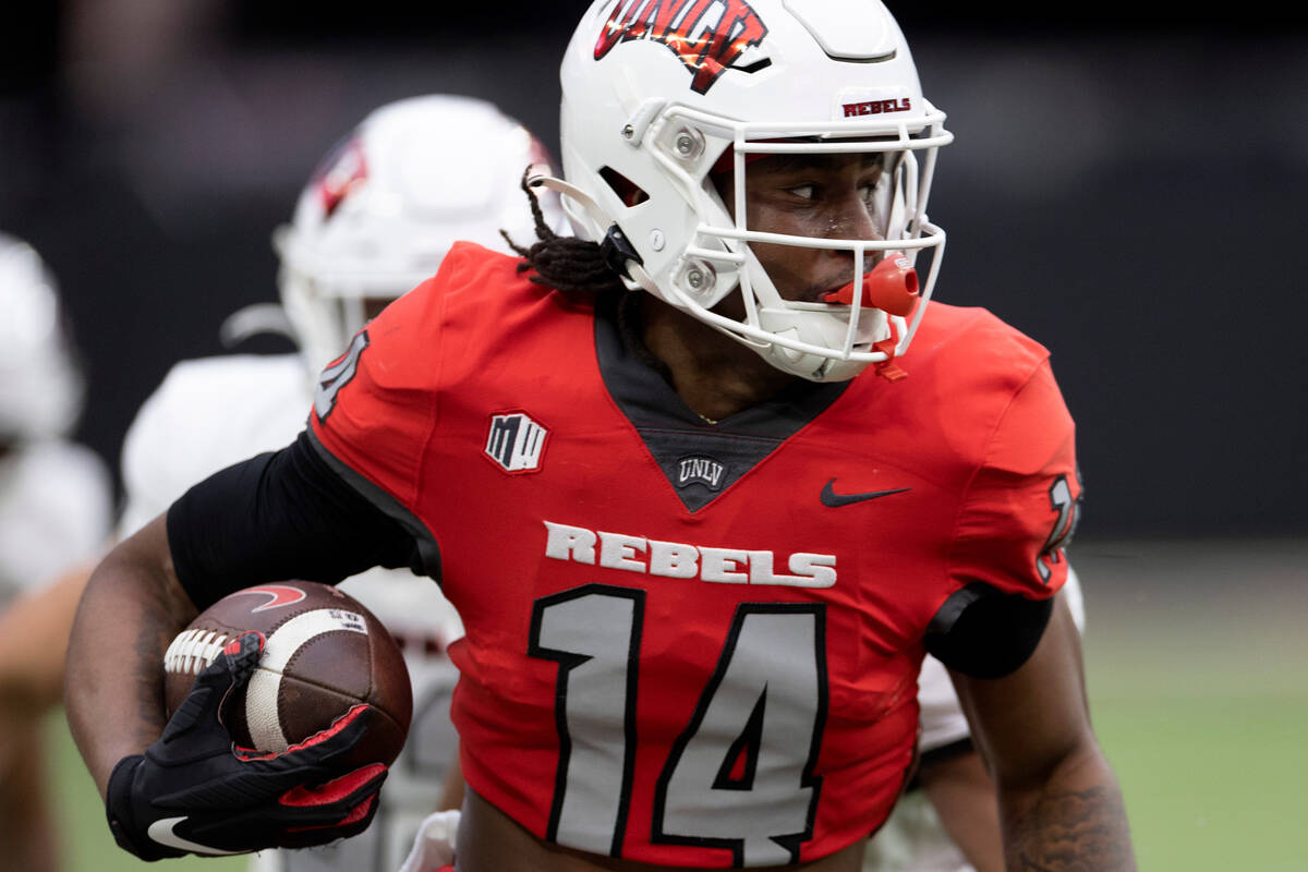 Wide receiver Zyell Griffin (14) runs the ball during the UNLV spring showcase game at Allegian ...