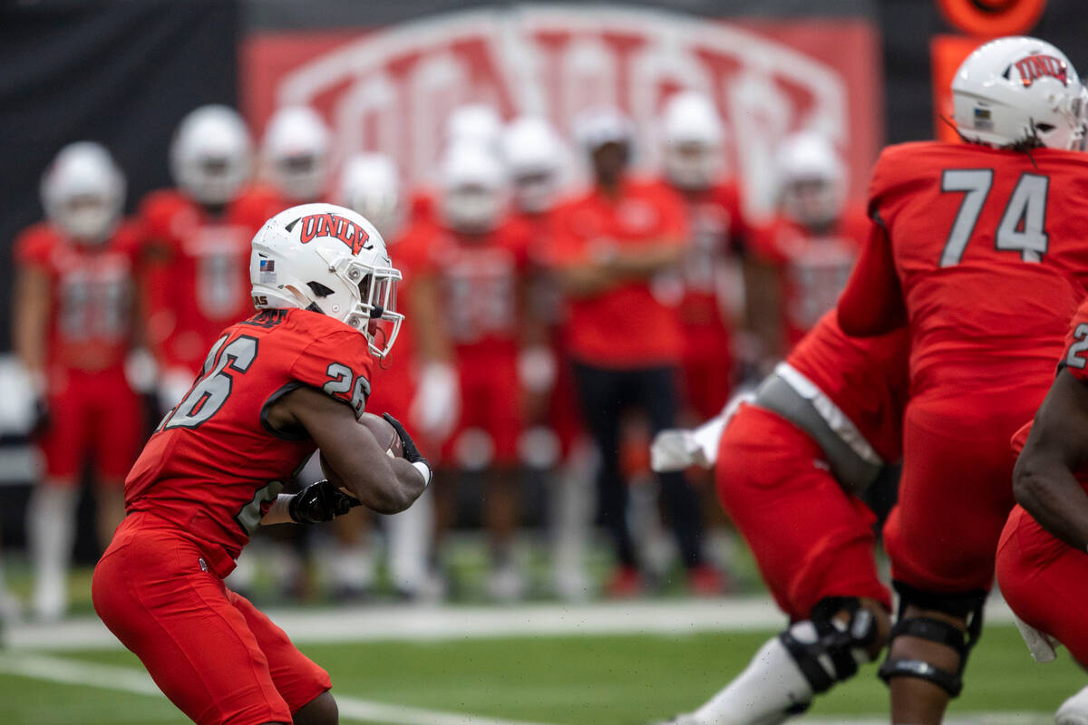 UNLV running back Courtney Reese (26) rushes during the first half of a scrimmage for the team& ...