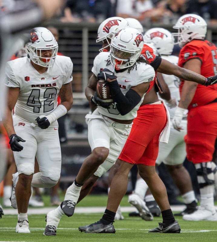 UNLV defensive back Johnathan Baldwin (3) runs with a football he intercepted during the second ...