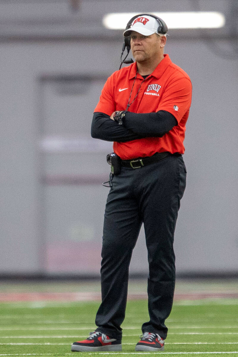 UNLV head coach Barry Odom looks on as his football team plays the second half of a scrimmage d ...