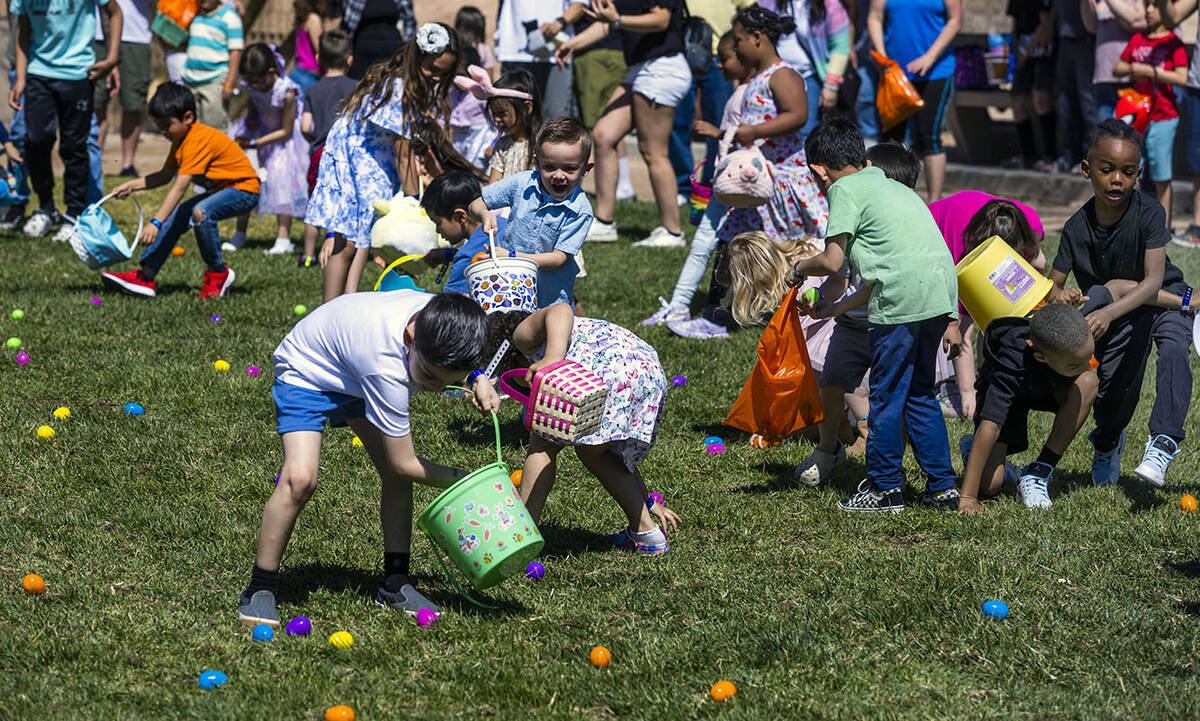 Children ages 4-7 take to the field to gather up the eggs during the annual Spring Carnival at ...