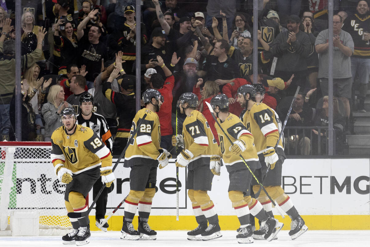 The Golden Knights celebrate after right wing Michael Amadio (22) scored his second goal of the ...