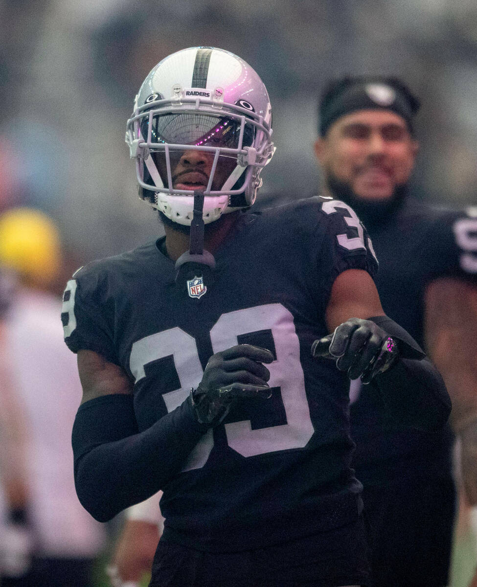 Raiders cornerback Nate Hobbs (39) dances on the sideline as T-Pain performs during halftime of ...