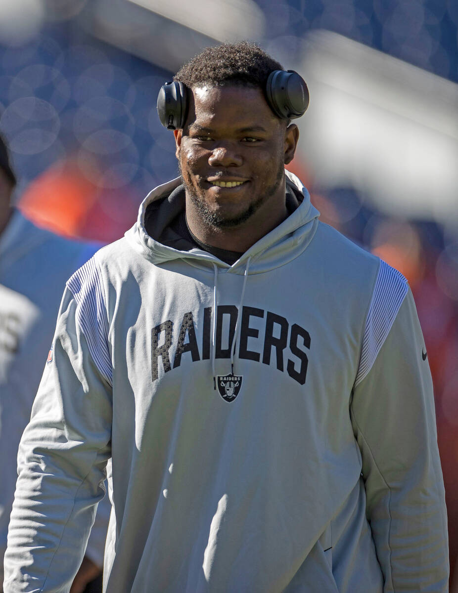 Raiders defensive tackle Bilal Nichols walks the field before an NFL game against the Denver Br ...