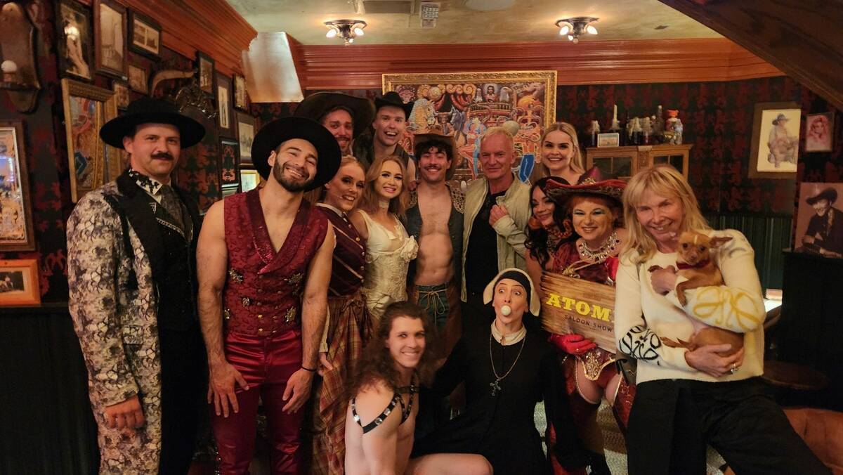 Sting and his wife, Trudie Styler, are shown with the cast of "Atomic Saloon Show" at Grand Can ...