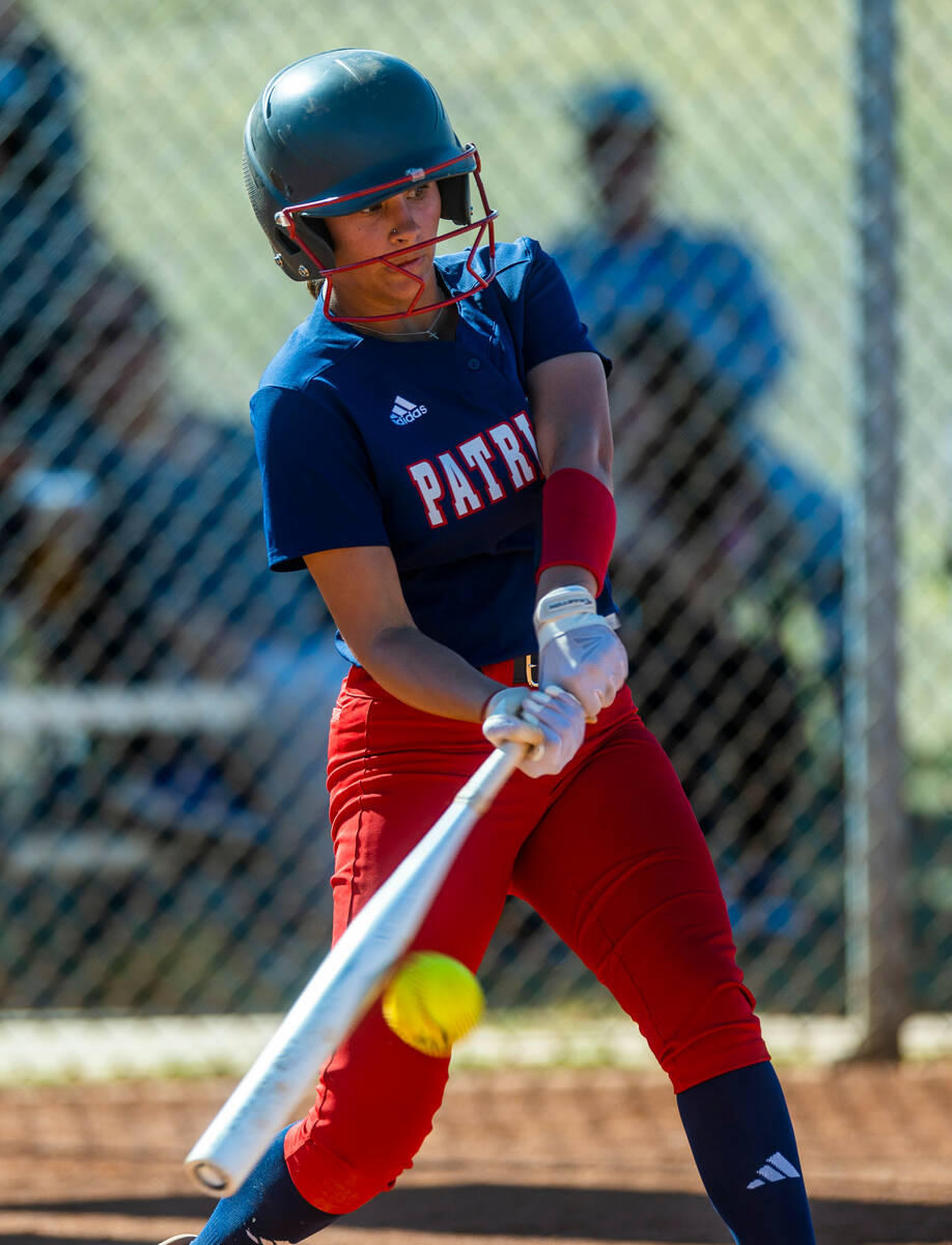Liberty batter Jazmine Arispe connects on a pitch against Centennial in the second inning durin ...