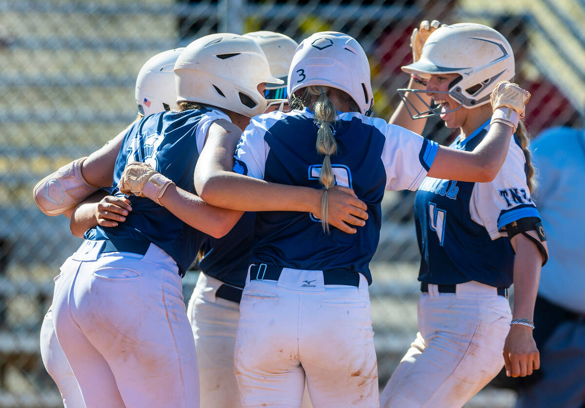 Centennial runner Teagan Clemmons, right, is celebrated for a grand slam with teammates against ...