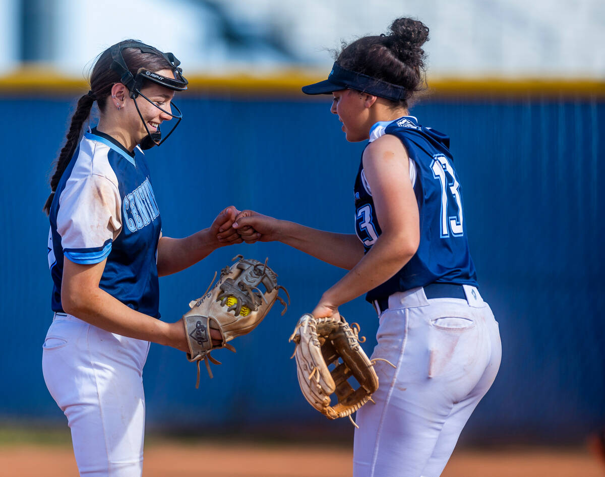 Centennial pitcher Lily Fournier comes connects with teammate Keana Bell in the fourth inning a ...