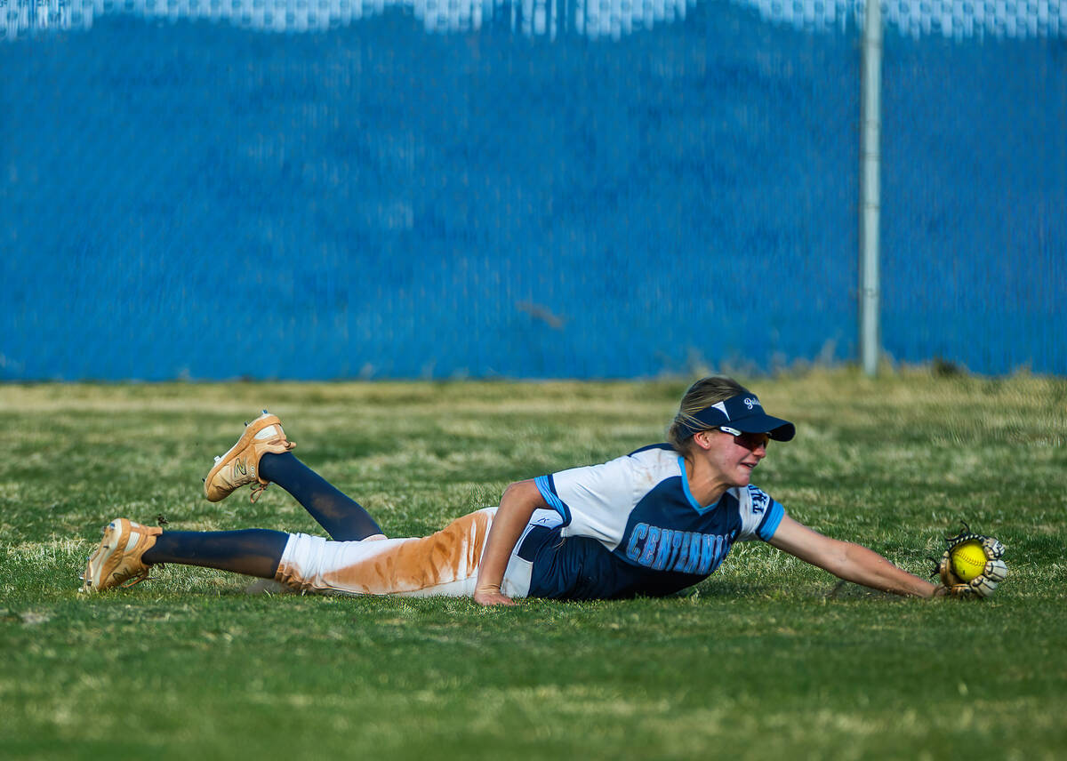 Centennial outfielder Ashley Madonia dives for an out against Liberty in the fifth inning durin ...