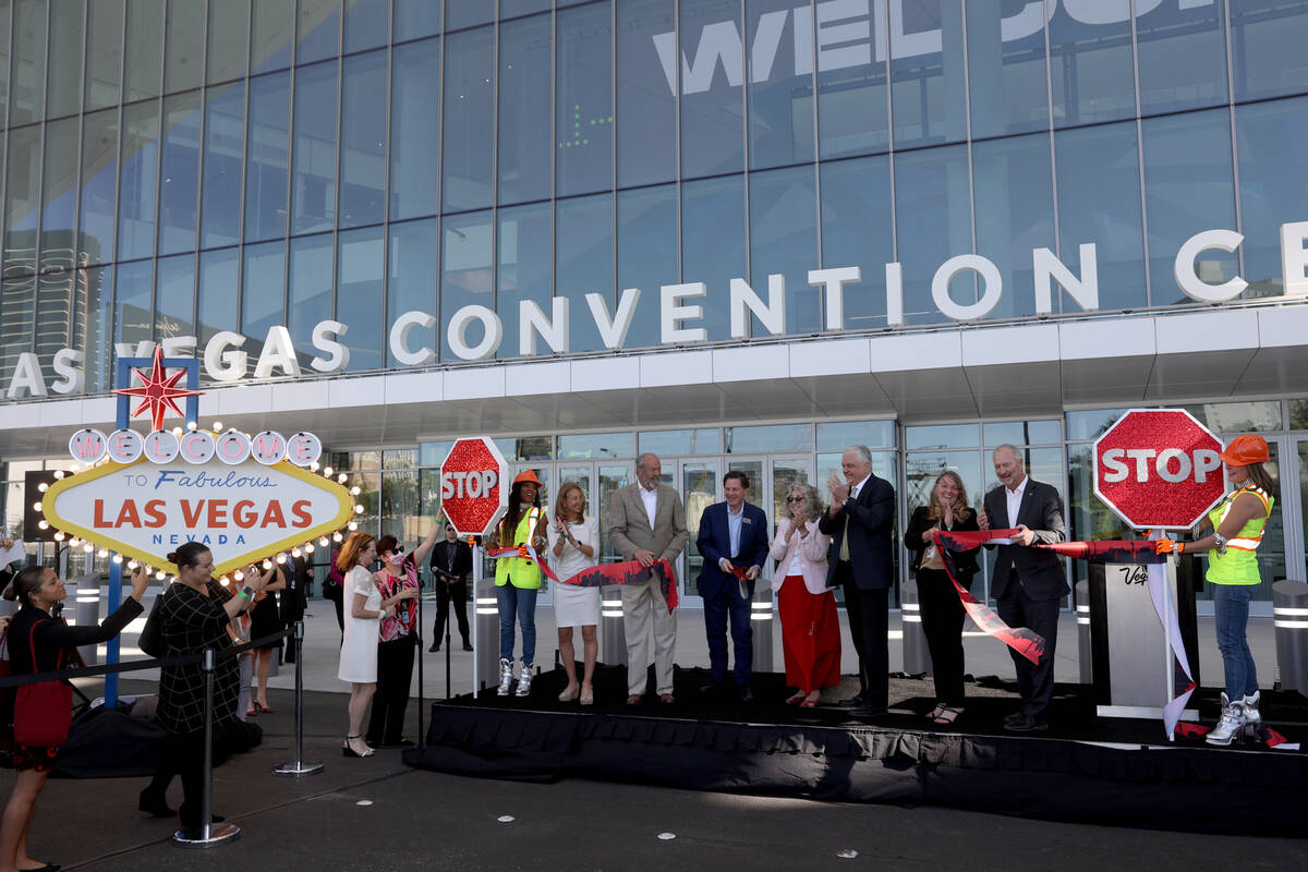 Dignitaries and government officials cut the ribbon to open the Las Vegas Convention Center's n ...