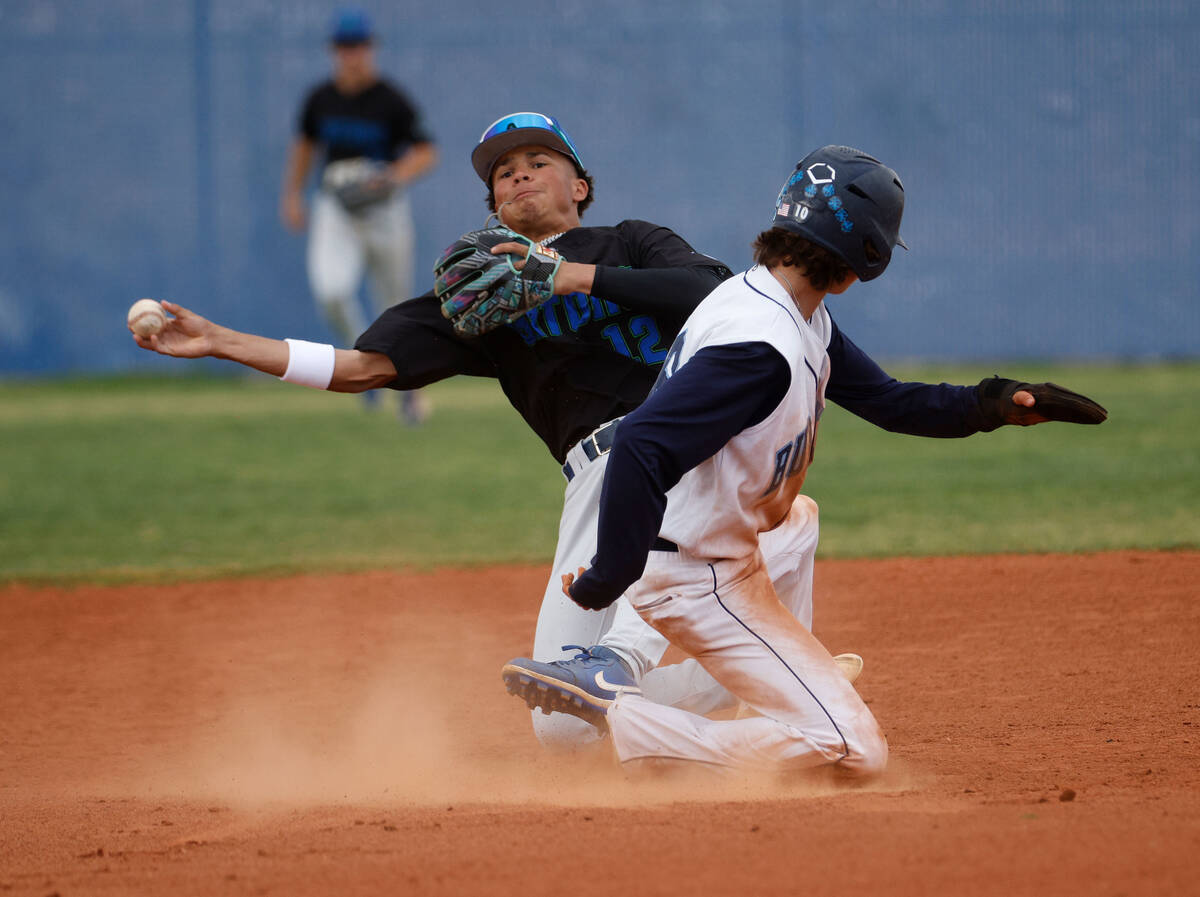 Green Valley's Caden Kirby (12), left, throws to first after forcing out Centennial’s Mi ...