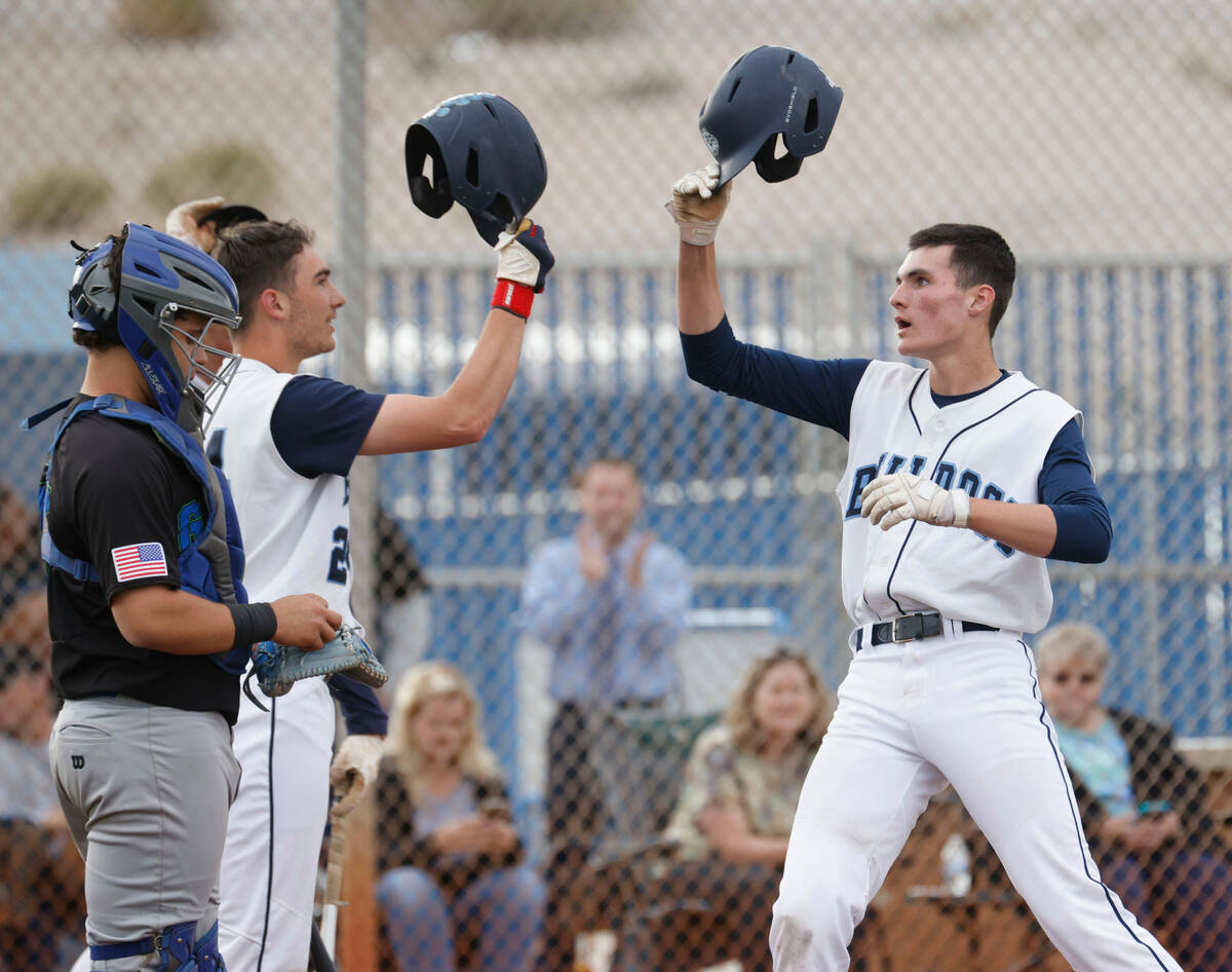 Centennial's Tyler Jackson (44), right, celebrate his solo home run with his teammate Centennia ...