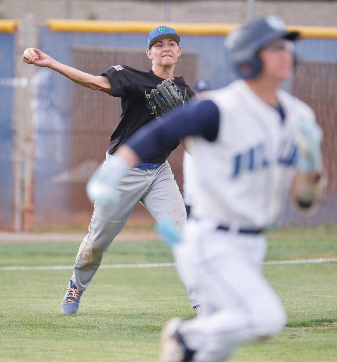 Green Valley's pitcher Bridger Knudson (8) throws to first to make Centennial's Noa Oyadomari ( ...