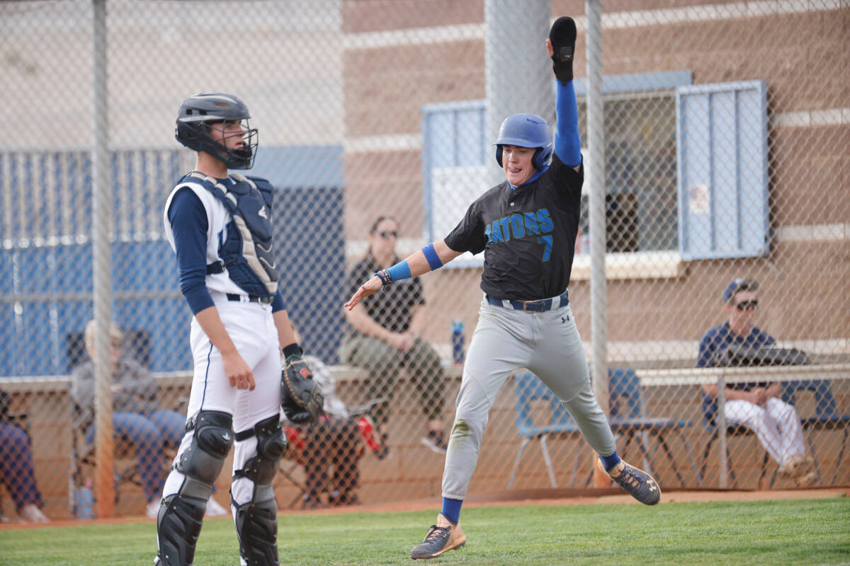 Green Valley's Brady Ballinger (7), right, reacts after scoring on a double by Green Valley's C ...