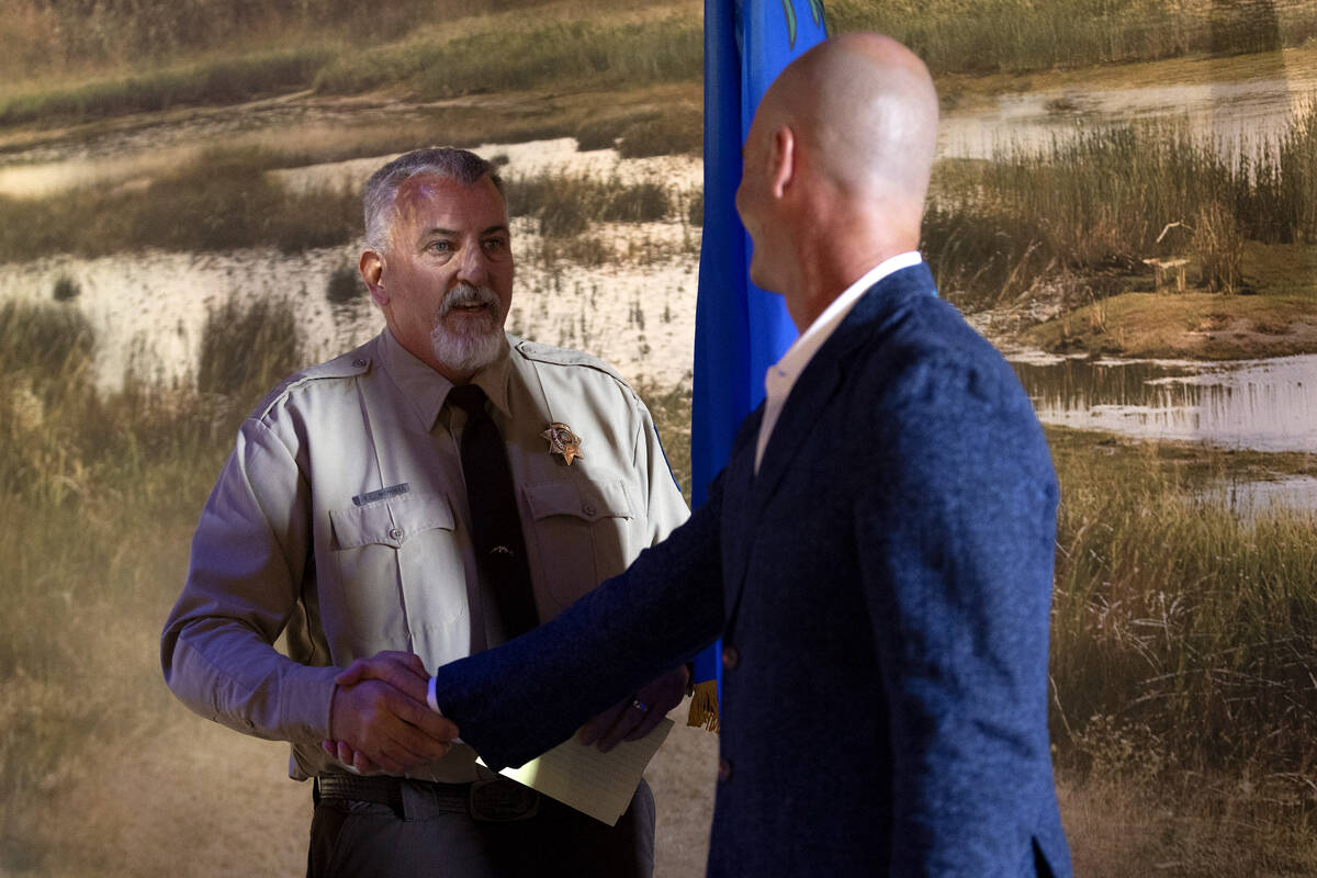 Nevada State Parks Administrator Bob Mergell shakes the hand of Walter Panzirer, trustee of The ...