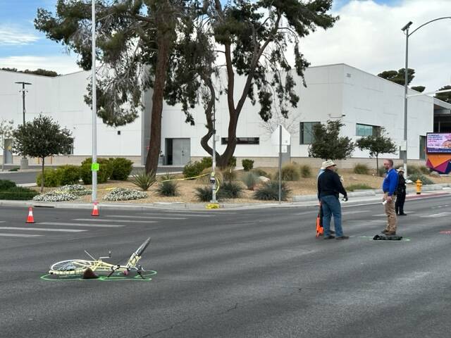A mangled bicycle rests in the intersection of East Bonanza Road and Wardelle Street after the ...