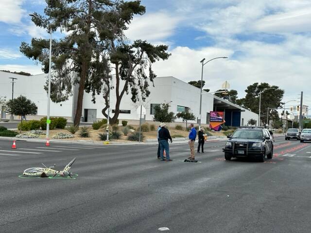 A mangled bicycle rests in the intersection of East Bonanza Road and Wardelle Street after the ...