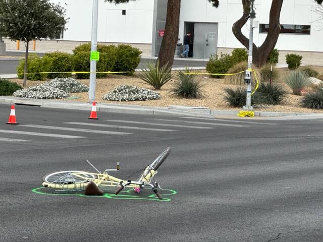 A mangled bicycle rests in the intersection of East Bonanza Road and Wardelle Street after the ...