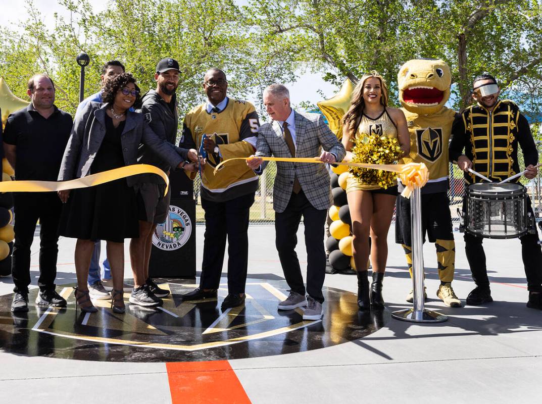 Vegas Golden Knights President Kerry Bubolz, fourth right, City Councilman Cedric Crear, center ...