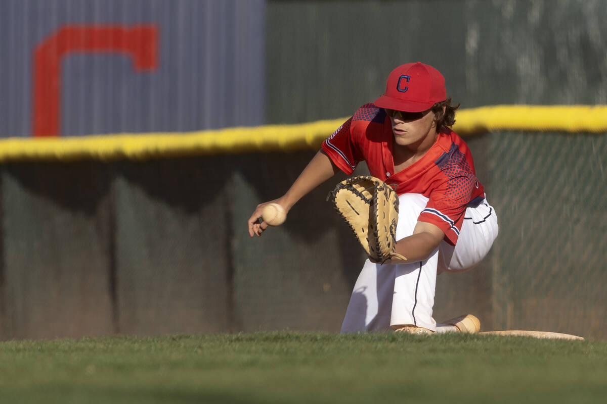 Coronado first baseman Noah Wong lunges to make the ccatch for an out during a high school base ...