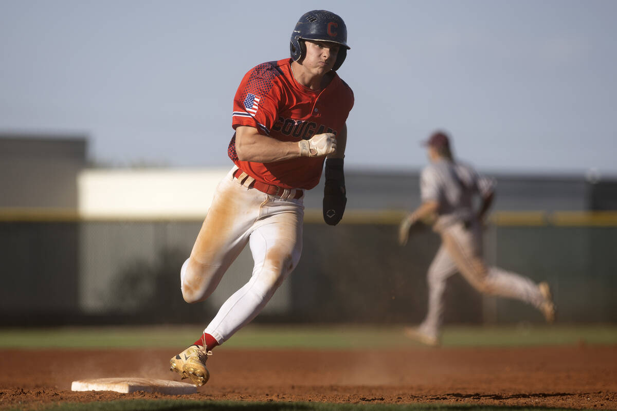 Coronado’s Caden Hunt rounds third base to scored an RBI during a high school baseball g ...