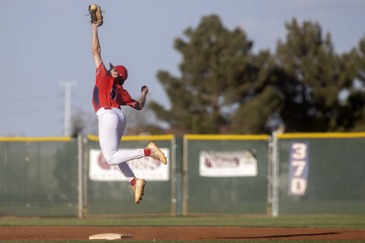 Coronado’s Louis Dion jumps but fumbles a catch during a high school baseball game again ...