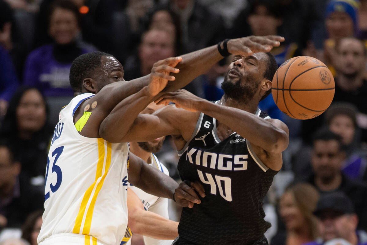 Sacramento Kings forward Harrison Barnes (40) is fouled by Golden State Warriors forward Draymo ...