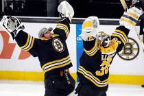 Boston Bruins' Linus Ullmark (35) and Jeremy Swayman celebrate the team's win over the New Jers ...