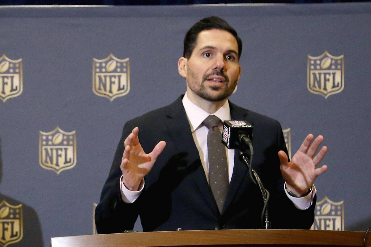 Dean Blandino, right, NFL vice president of officiating, talks as St. Louis Rams head football ...