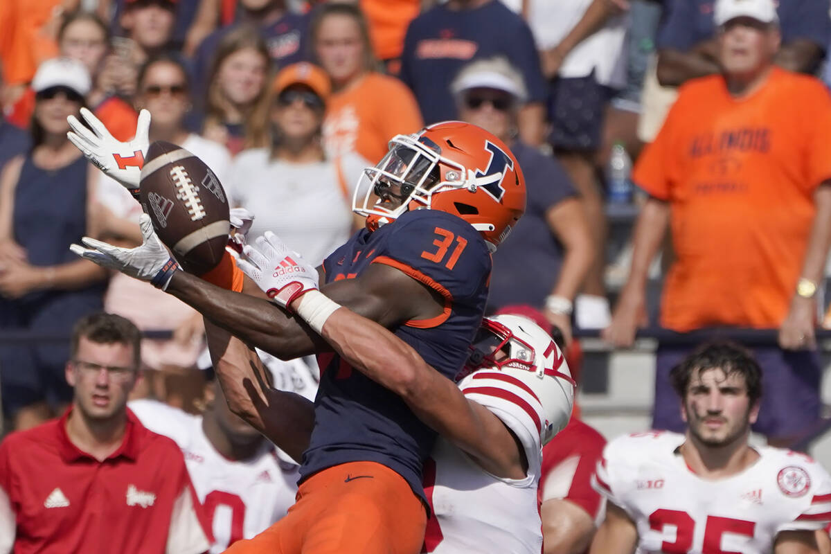 Illinois defensive back Devon Witherspoon steps in front of and breaks up a pass intended for N ...