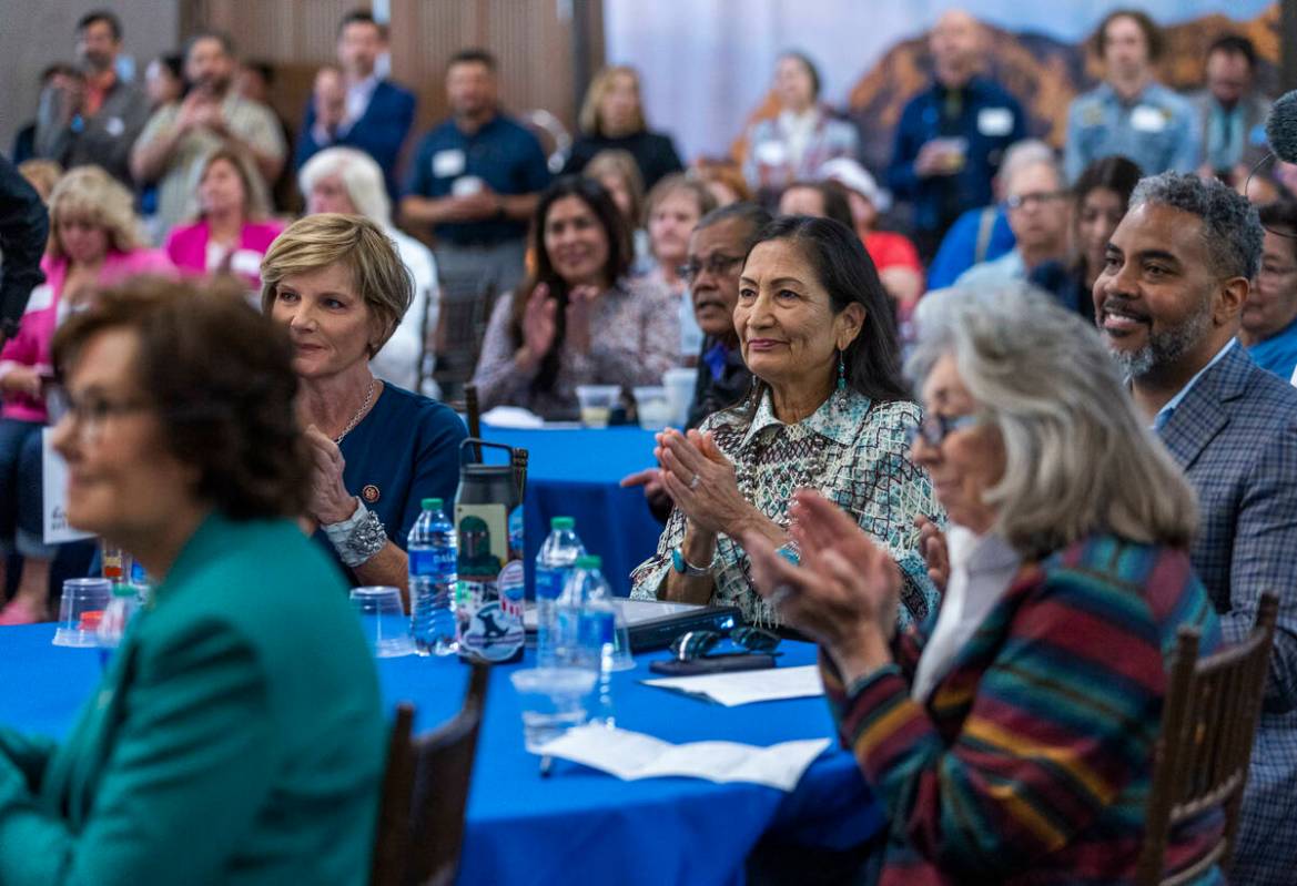 Department of Interior Secretary Deb Haaland, right center, applauds as she joins other leaders ...