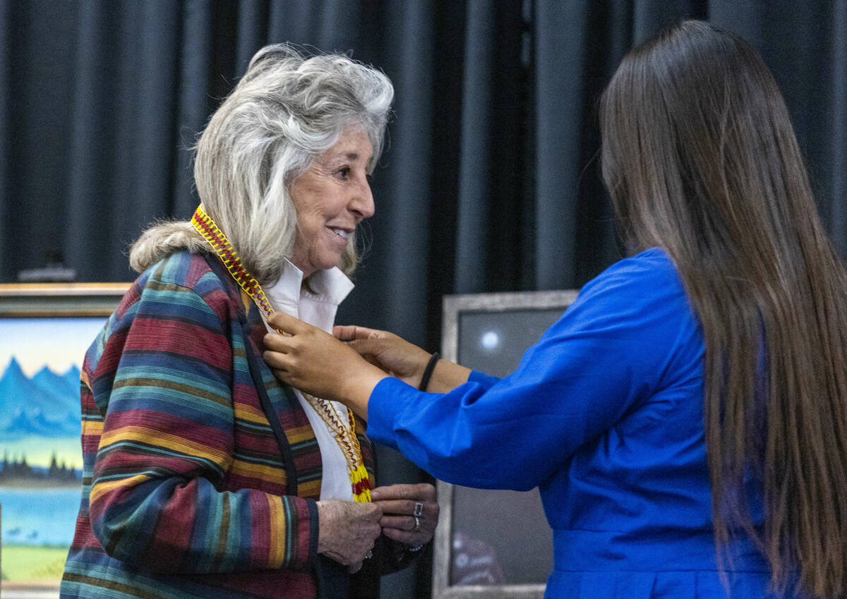 Congresswoman Dina Titus receives a Hunaak, a beaded necklace adorned by the Mojave people and ...