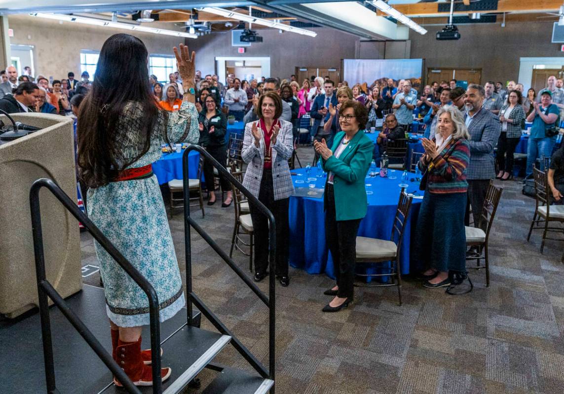Department of Interior Secretary Deb Haaland waves to other leaders, Nevada tribal members and ...