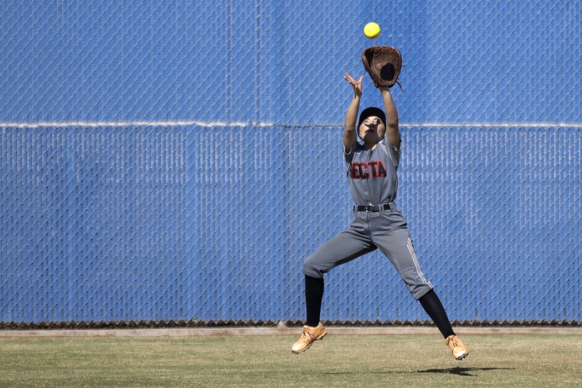 Tech’s Kaylee Farasy jumps to catch for an out during a high school softball game agains ...