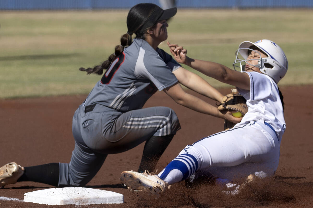 Tech’s Bryanna Romero tags Bishop Gorman’s Allie Bernardo out at third base durin ...