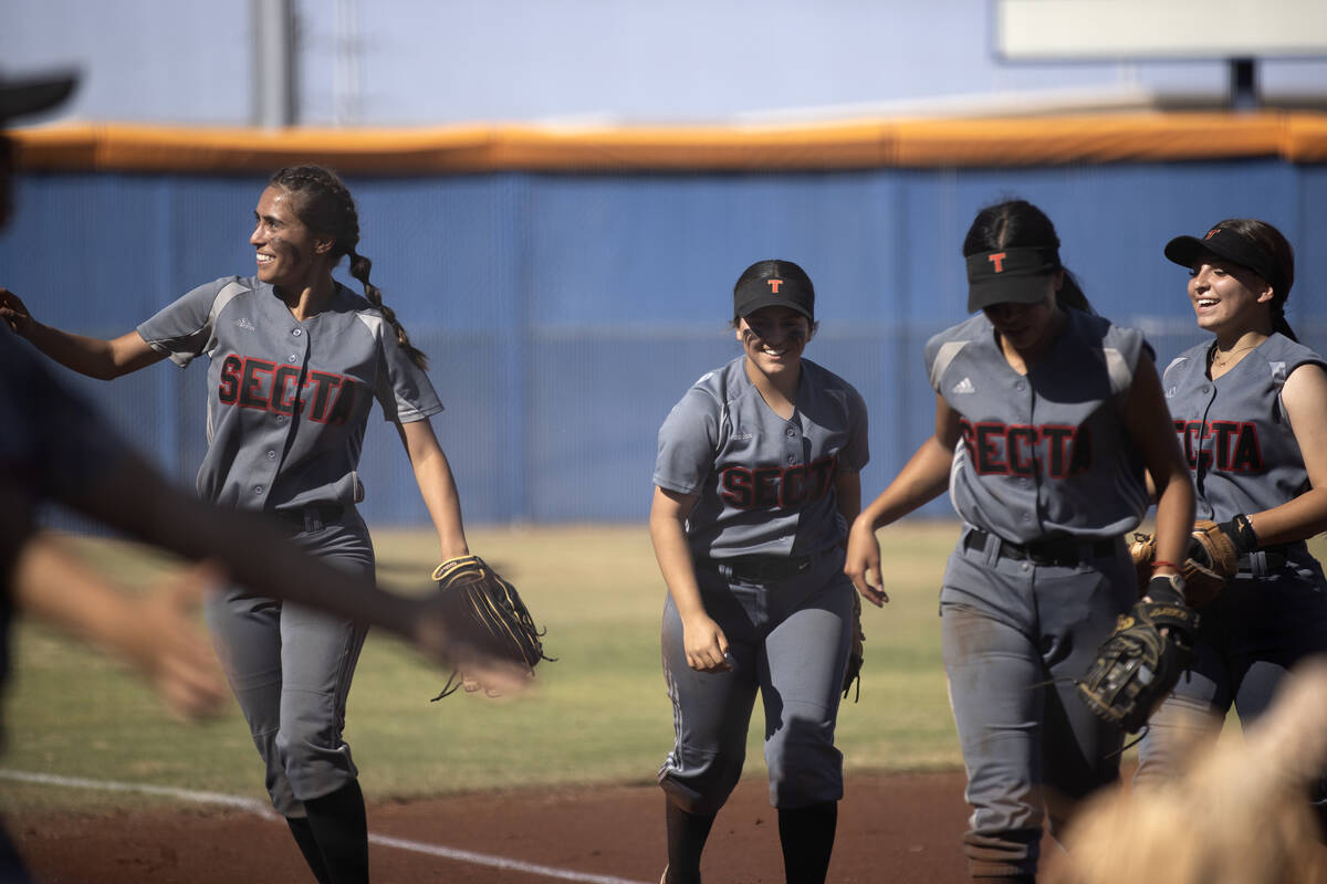Tech celebrates ending an inning during a high school softball game against Bishop Gorman at Bi ...