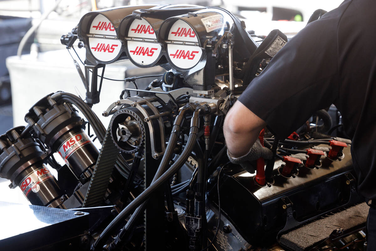 NHRA driver Matt Hagan’s team members check his funny car before the first Nitro qualify ...