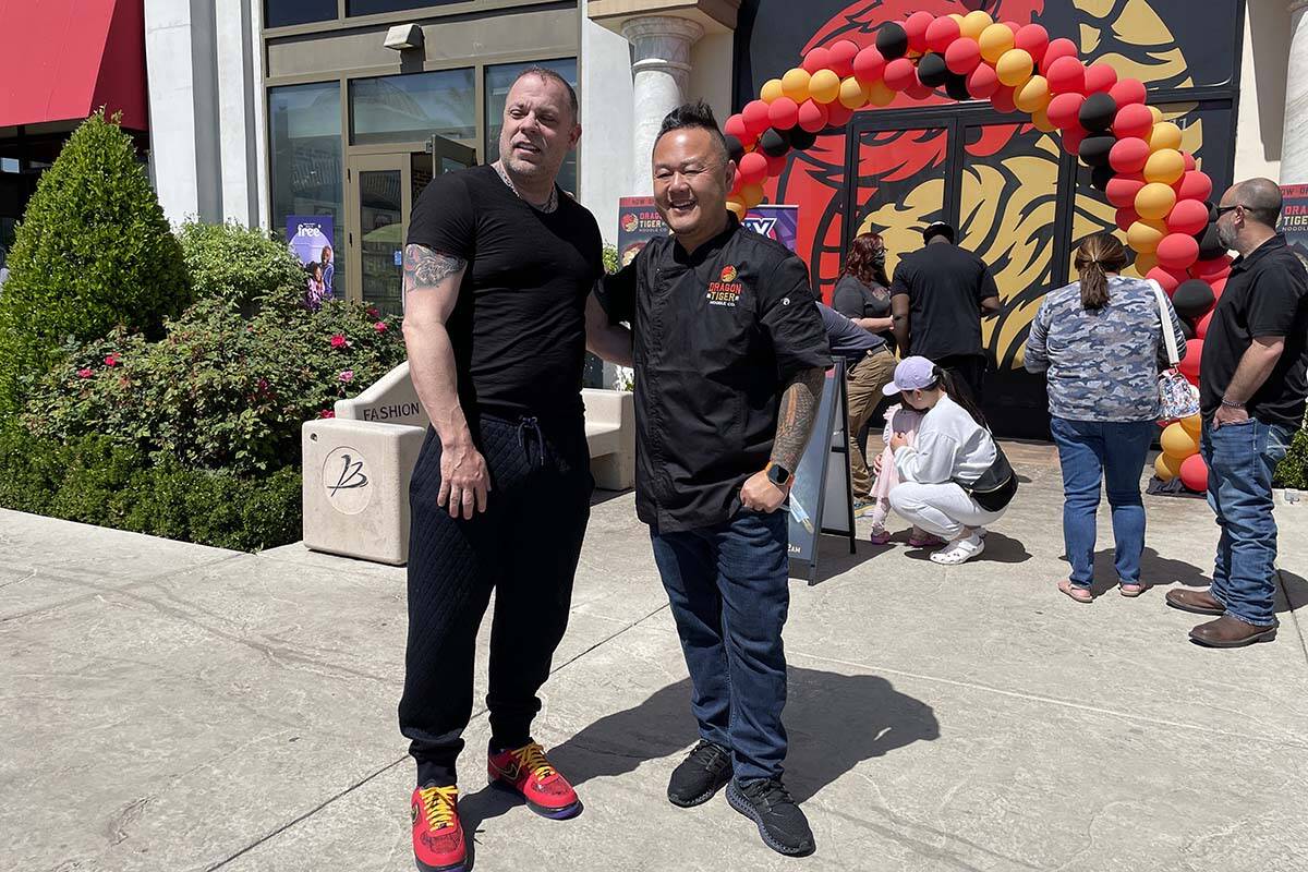 Eric Persson and Jet Tila celebrated the grand opening of the Dragon Tiger Noodle Co.'s latest ...